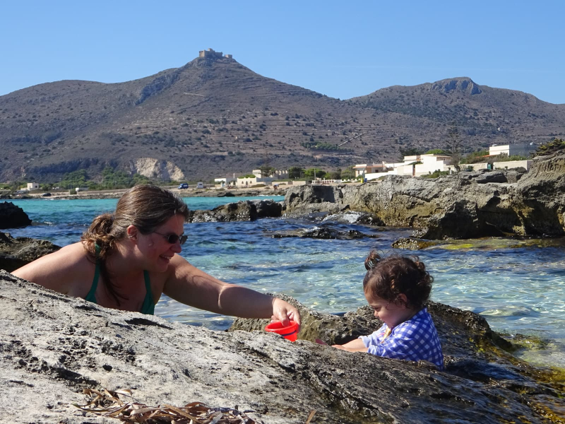 Melissa and Francesca at Lido Burrone beach (with a Norman fortress on the hill in the background)