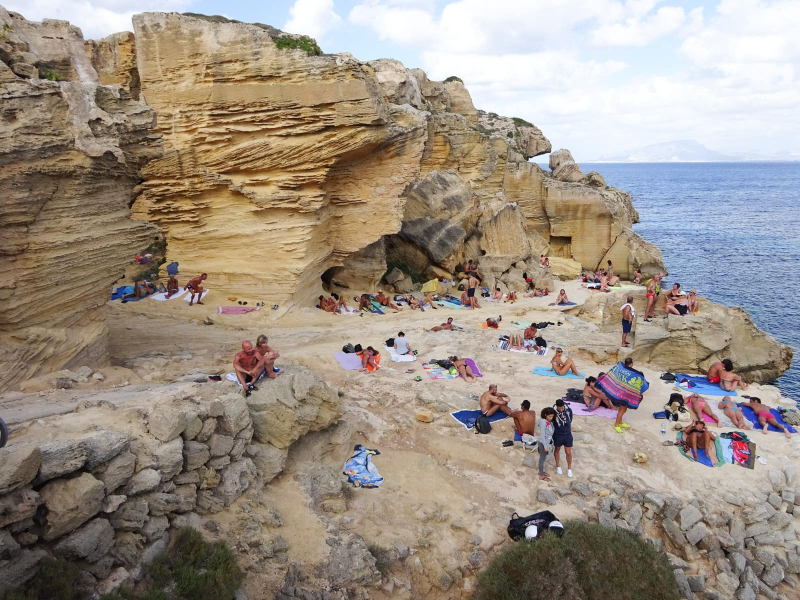 Where there aren't beaches, Favignana tourists sunbathe on the rocks
