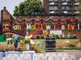 Setting up the stage, by a gate in the old city's walls, where dignitaries would kick off the annual Chiang Mai Flower Festival a few hours later