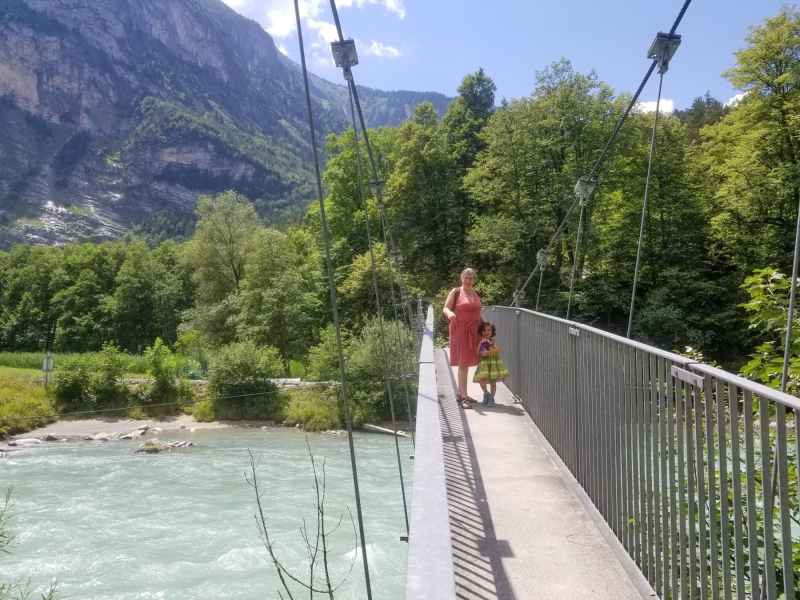 Crossing a foot bridge over the Aare River in Meiringen