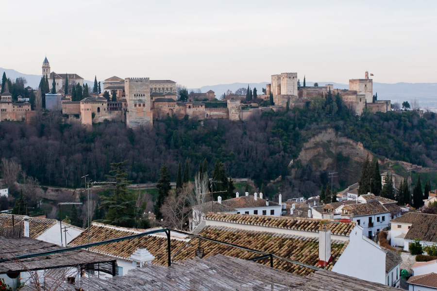 The Alhambra is a 12th- to 14th-century Moorish city, palace, garden, and fortress on a hill in Granada.
