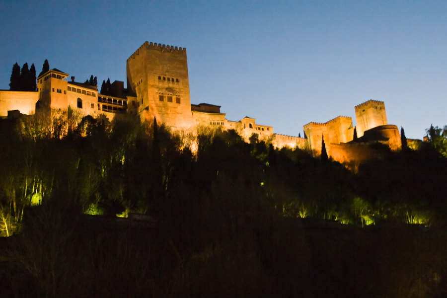 The Alhambra lit up at night.