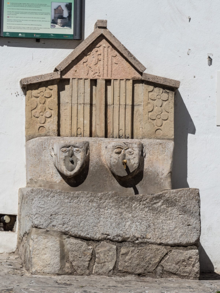 A two-face fountain in the middle of the village. This one marked the dividing line between the village's two main neighborhoods.