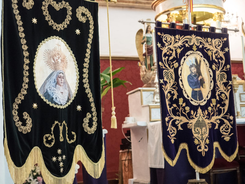 Banners in the church by the cemetery, ready for Easter Week processions