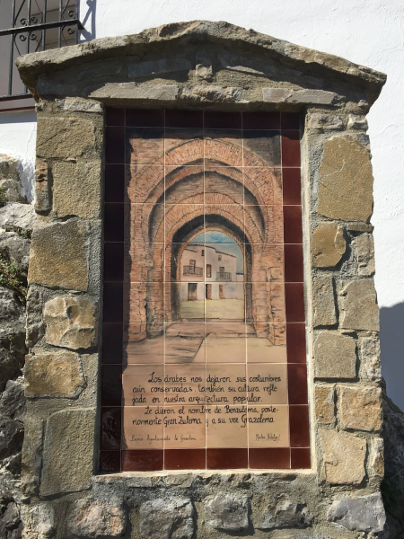 A plaque showing what the main gate to the village might have looked like in Moorish times (700s to 1400s)
