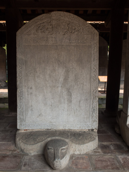 The plaques are mounted on carved tortoises, symbols of longevity and success