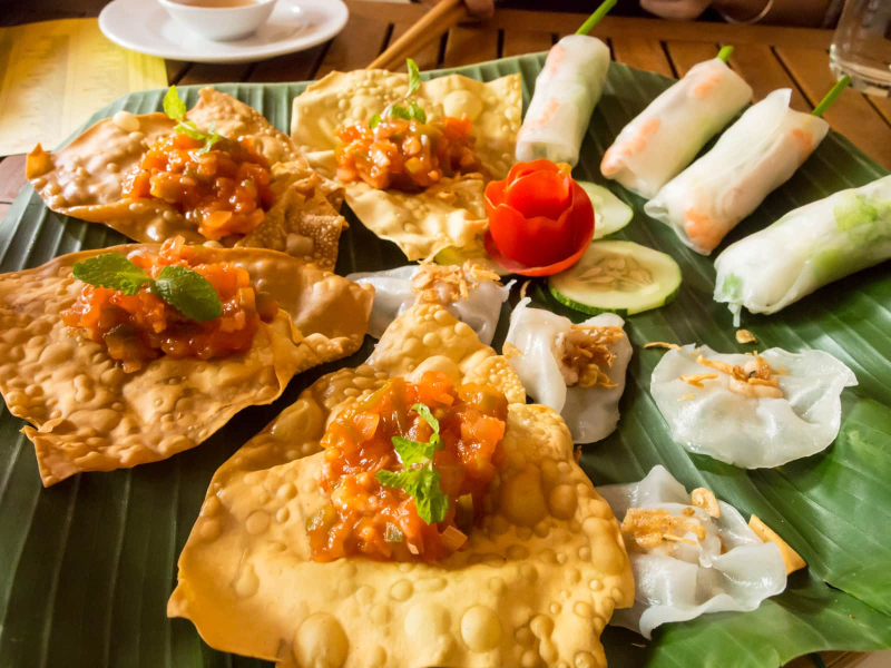 Hoi An specialties: fried wontons, White Rose dumplings stuffed with shrimp, and rice paper summer rolls 