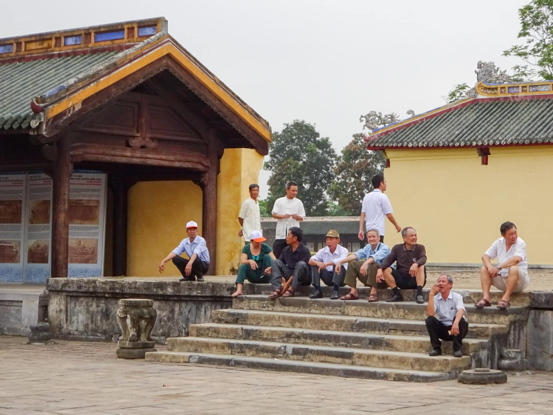Vietnamese employees and visitors lounging around the citadel