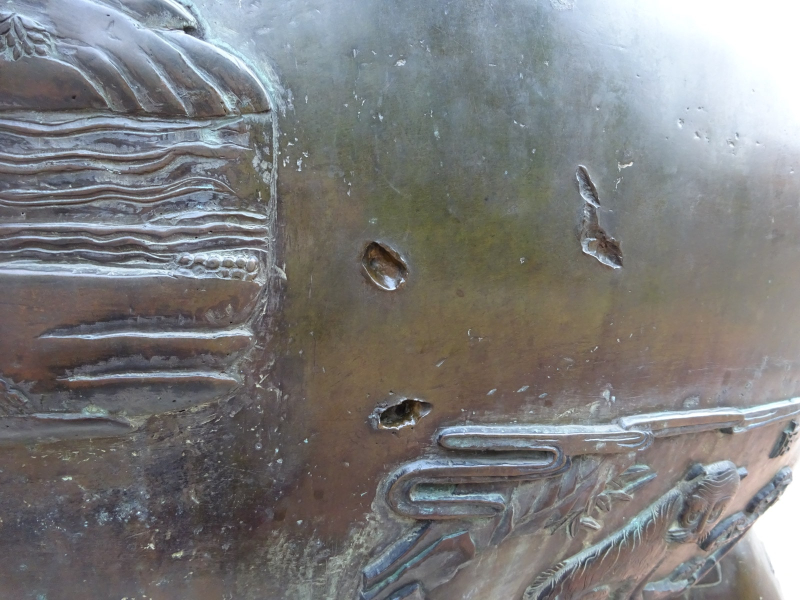 Many of the urns have bullet marks from the battles fought in Hue