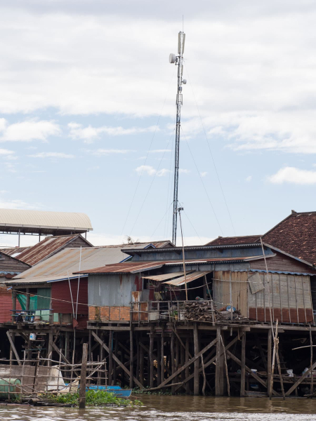 These days, even a flooded village has electricity lines and a cell tower