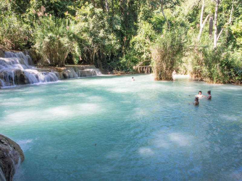 The pools below the waterfalls are a popular local swimming hole, with sandy bottoms and cold water