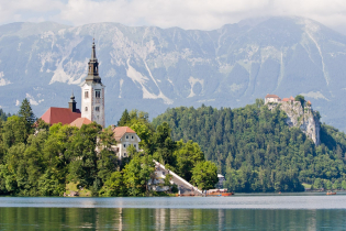 Slovenia's most popular vacation spot, Lake Bled, features a tiny island with a church, a castle on a crag, and lots of tourists