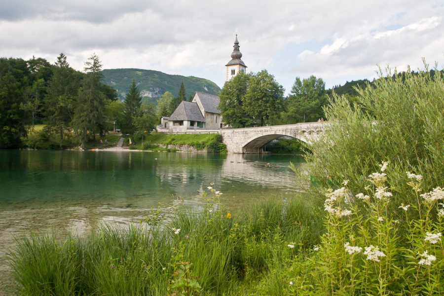 The bridge and church in our lakeside village of Ribcev Laz