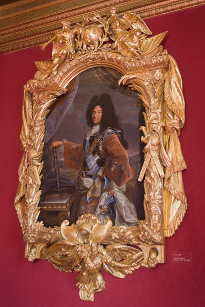 A portrait of Louis the 14th in an amazing frame