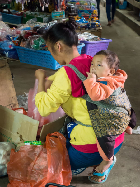 Laos is the first place in Asia where we've seen babies carried on people's back