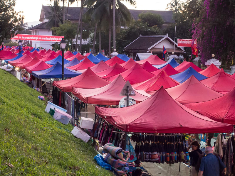 Tents set up for Luang Prabang's nightly craft market at the base of Phousi hill