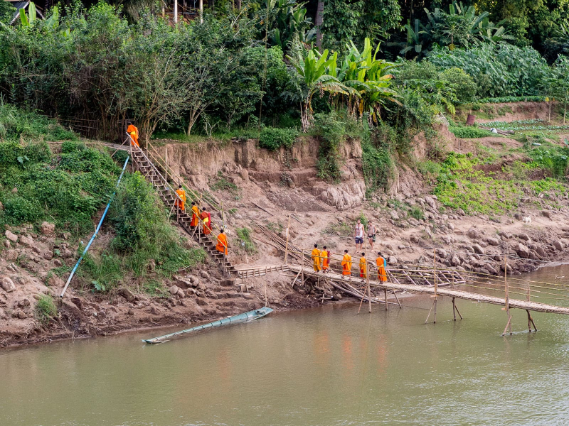 Groups of monks crossed the bridge every afternoon around 4, returning from studies in Luang Prabang to their wats on the other side of the Nam Khan river