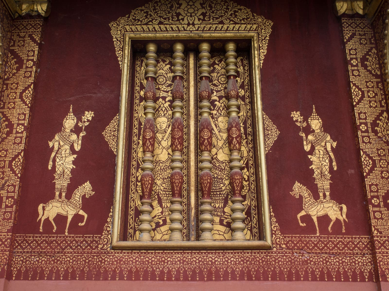 Stenciling is a common decorative feature of wats in Luang Prabang