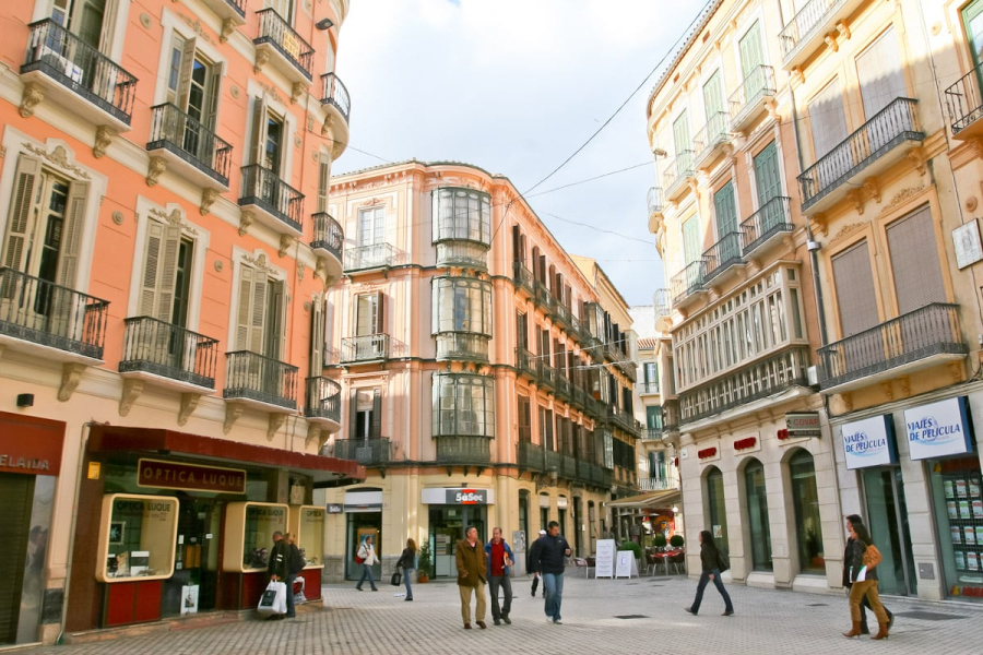 The characteristic pedestrian plazas and balconied windows of the old center of Malaga.
