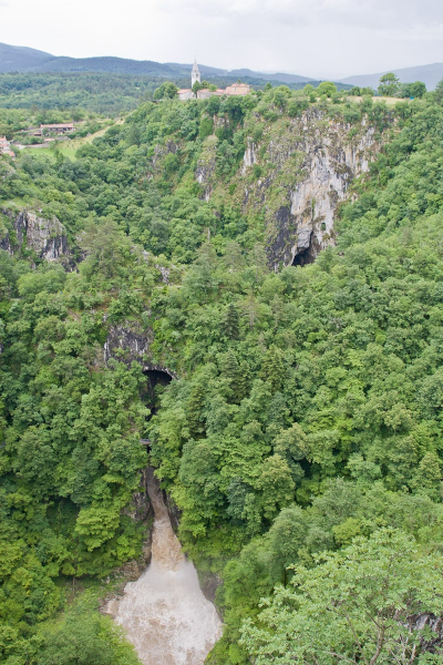 Water pours out of the caves below Skocjan