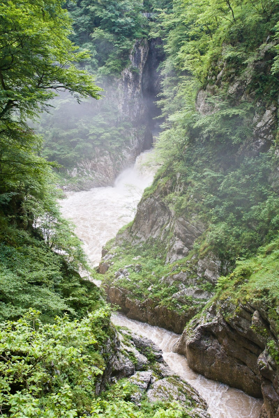 The misty Reka River leaving the caves