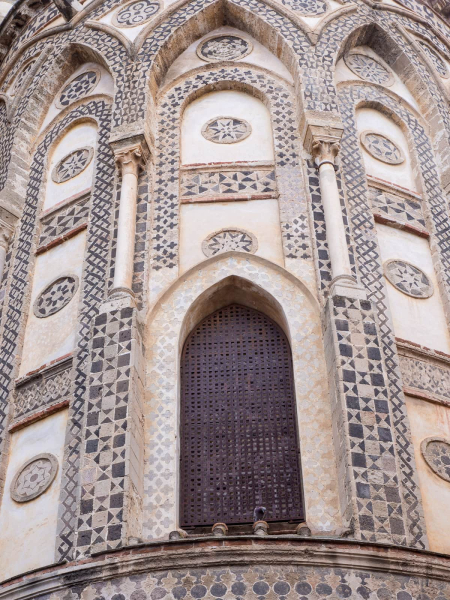 The exterior of the back of the cathedral shows elements of Arab design; Sicily was a center of Arab culture for centuries before the  Normans conquered it.