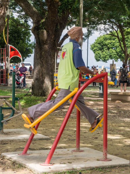 A Sikh gentleman takes his exercise in the park