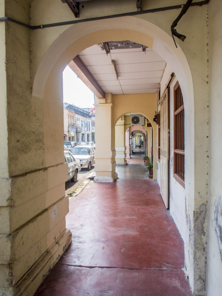 The covered galleries in front of shophouses provide much-needed sidewalks and shelter on rainy days