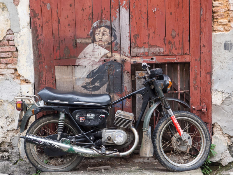 Some of the most famous pieces of Penang street art incorporate real objects