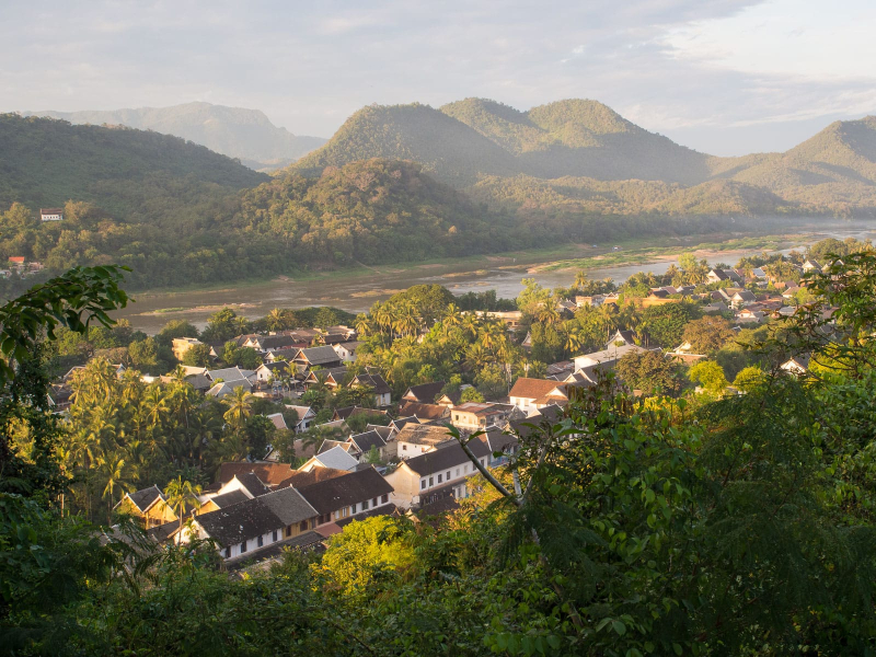 Higher up the hill, there are wonderful views over downtown Luang Prabang, with the Mekong river on one side . . .