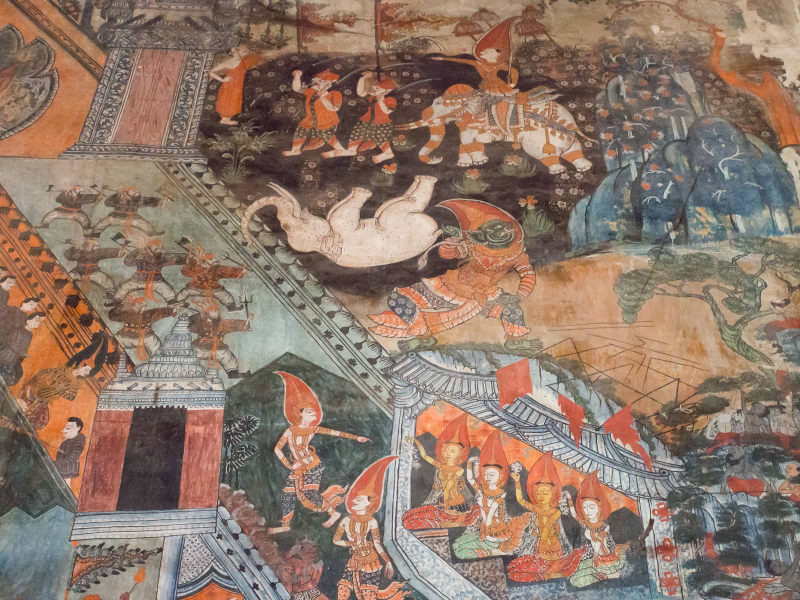 In the center, a demon captures a white elephant