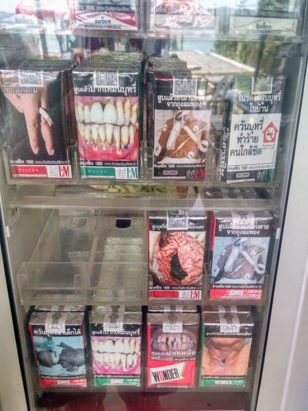 Cigarette packages in Thailand (like the ones in this vending machine) carry graphic photos of the health effects of smoking