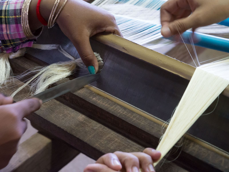 Warping is a painstaking process with threads as thin as a human hair