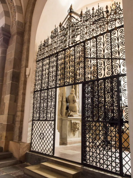 An impressive iron gate to a side chapel 