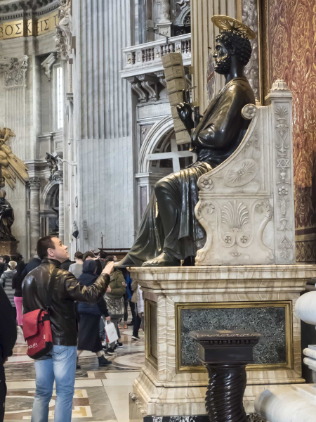 Many visitors rub St. Peter's foot for blessing