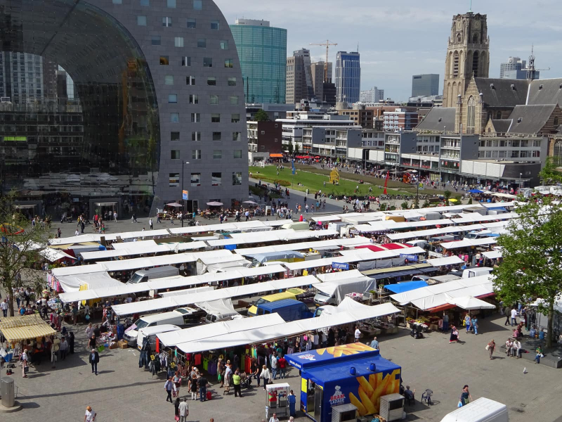 The view from our apartment window of Rotterdam 's largest street market, held twice a week in Blaak Square