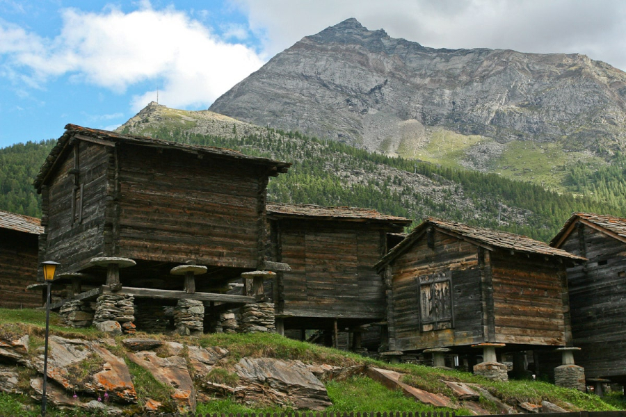Grain storage barns typical of the Saas Valley, set on pillars with big round stones to keep rodents from climbing up