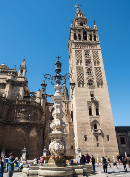A fountain and the Giralda in the main plaza outside the cathedral