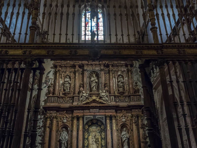 The cathedral has dozens of chapels, most covered by iron grilles and full of carved altars and paintings