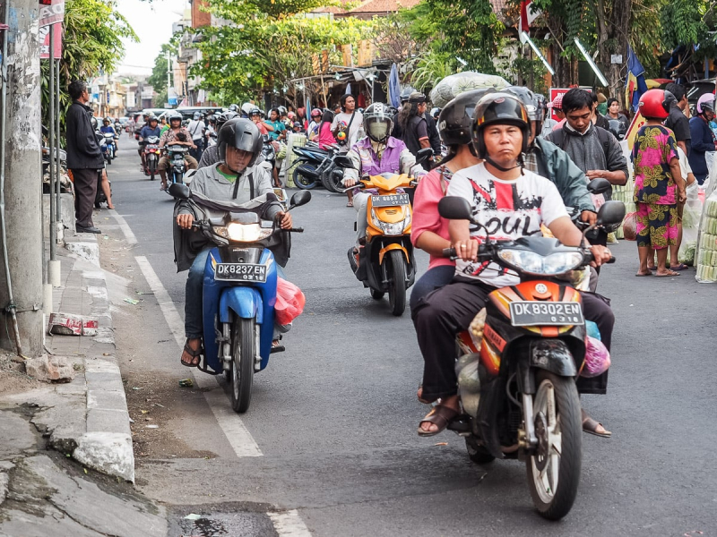 Crumbing sidewalks and zoomings motorcycles make Denpasar's streets a challenge for pedestrians.