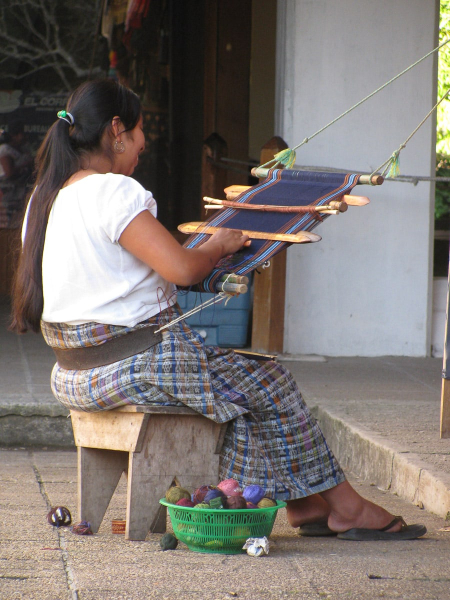 A modern Maya woman weaving at the visitors' center