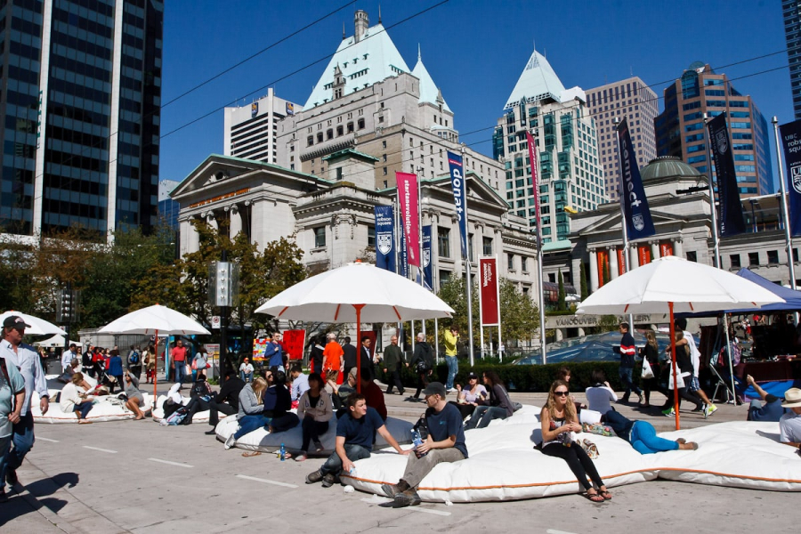 The "beach" in front of the Vancouver Art Gallery, with umbrellas and extremely hard bean bags