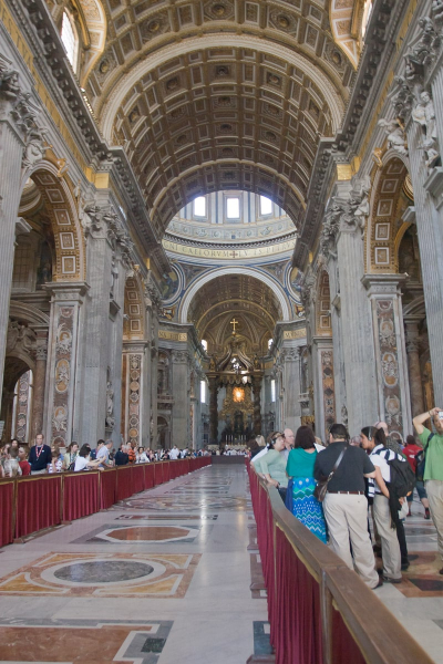 The soaring space of of the basilica somehow swallows up the crowds