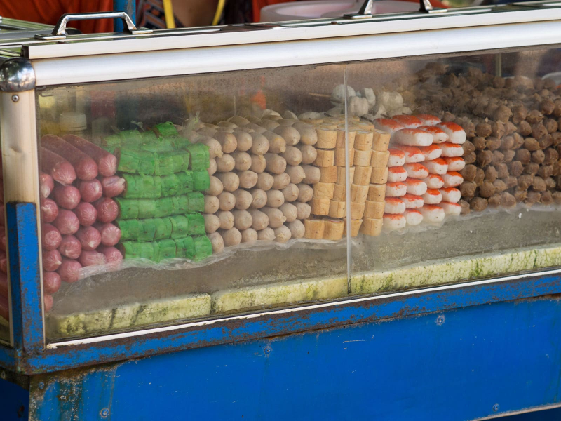 . . . and the dubious-looking hot dogs and other mystery meats sitting out in the sun (why is one of them green?)