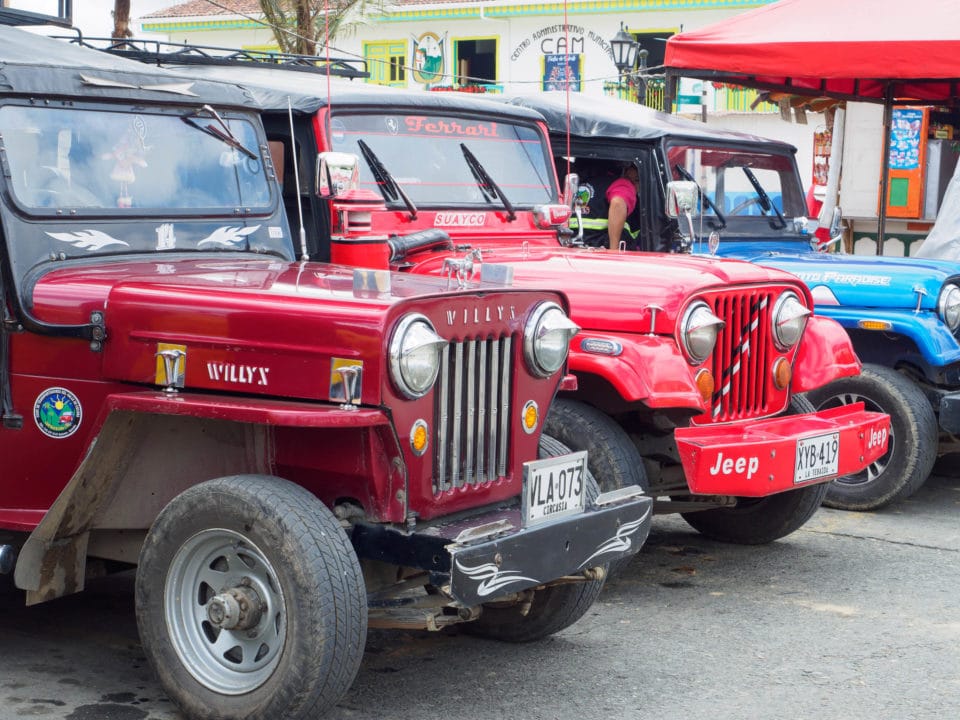 Line of red Willys jeeps