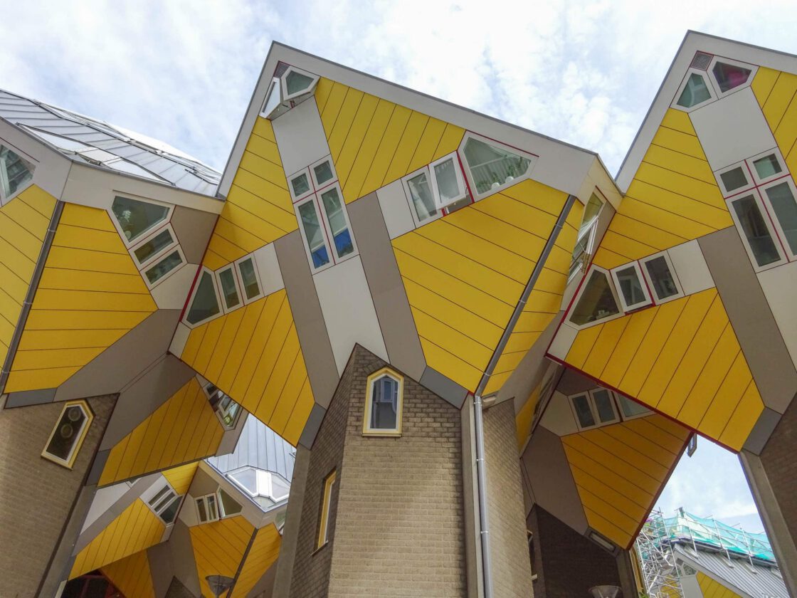 Yellow cube-shaped houses on cement bases