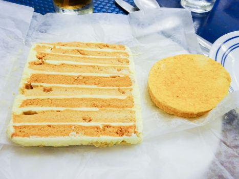 Slice of sans rival cake and silvana cookie