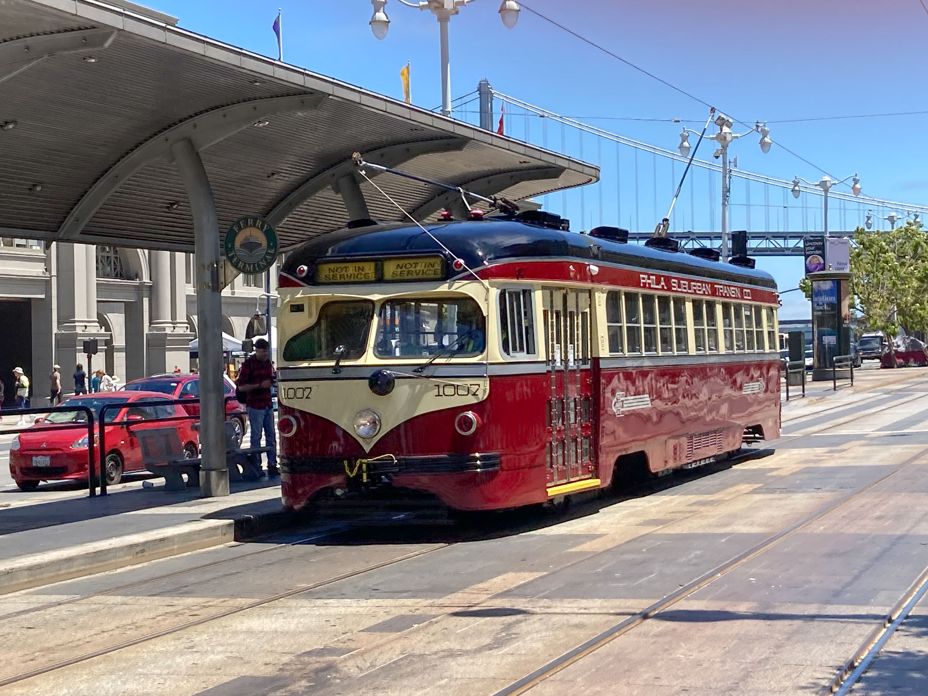 Restored 1940s red streetcar at stop near Ferry Building