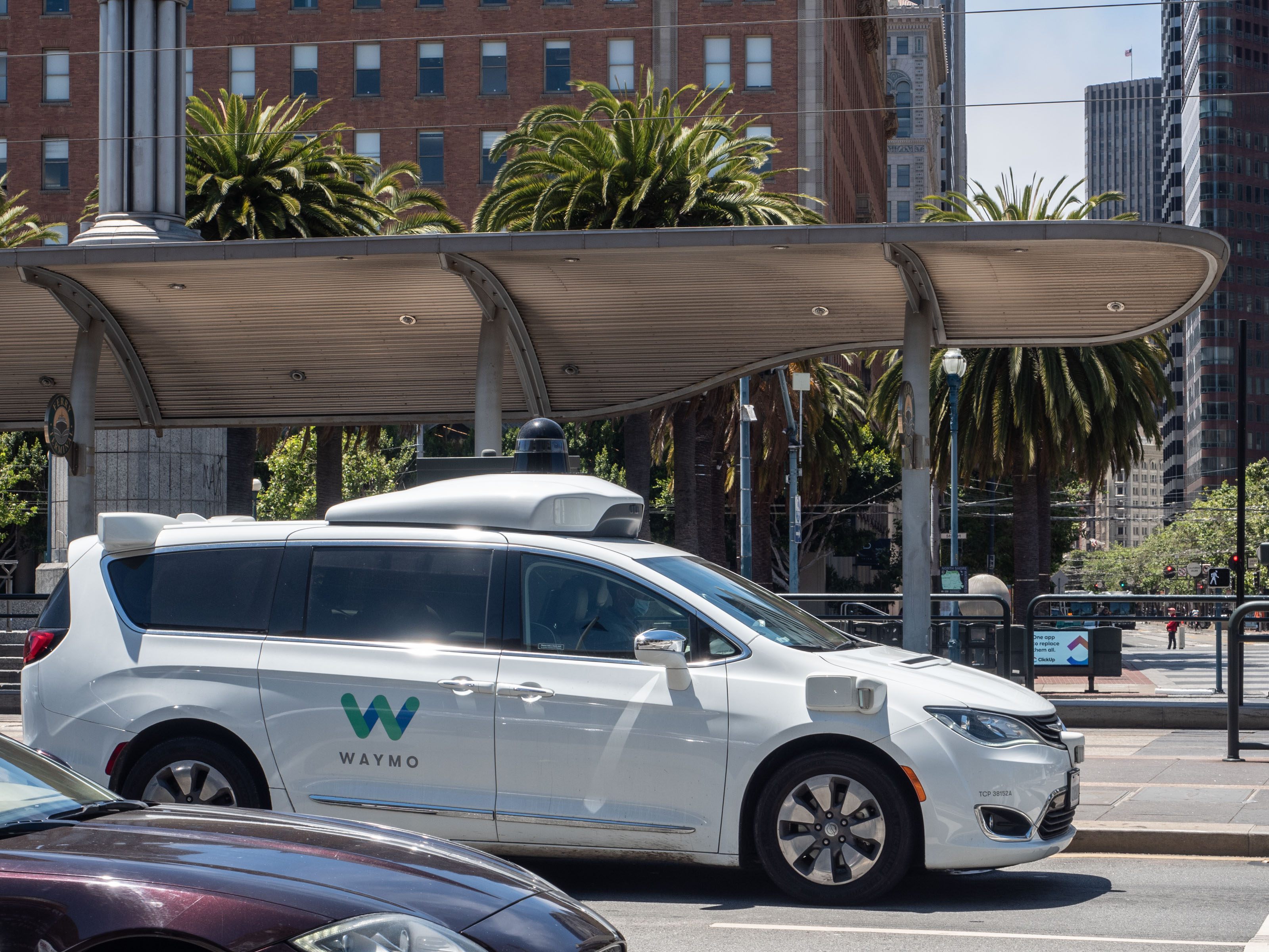 White Waymo self-driving taxi