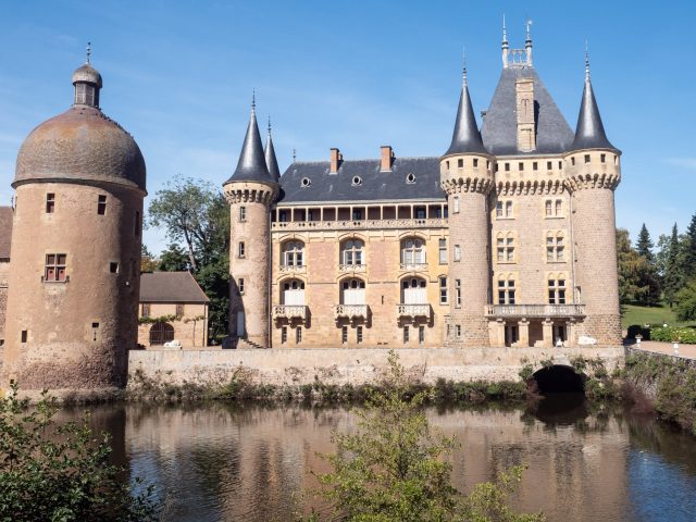 Chateau of La Clayette with tall pointed towers and lots of windows